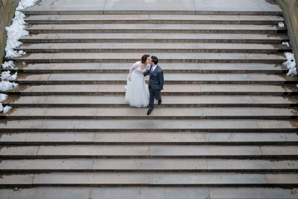 Wedding couple descending the stairs at Bethesda Terrace in Central Park