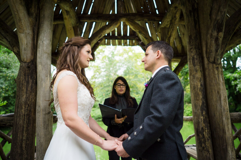 Bride and groom exchanging vows in Wagner Cove