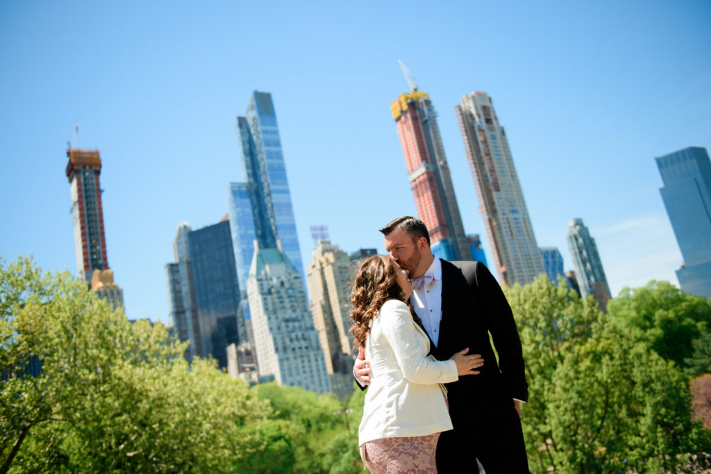 Skyline of skyscrapers over Central Park wedding couple